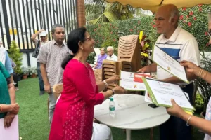 suraj prakash issing certicate at the amend annual meet 2026